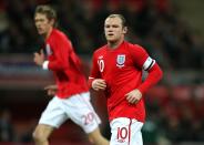 <p>England’s Wayne Rooney wears the captain’s armband in 2010 </p>