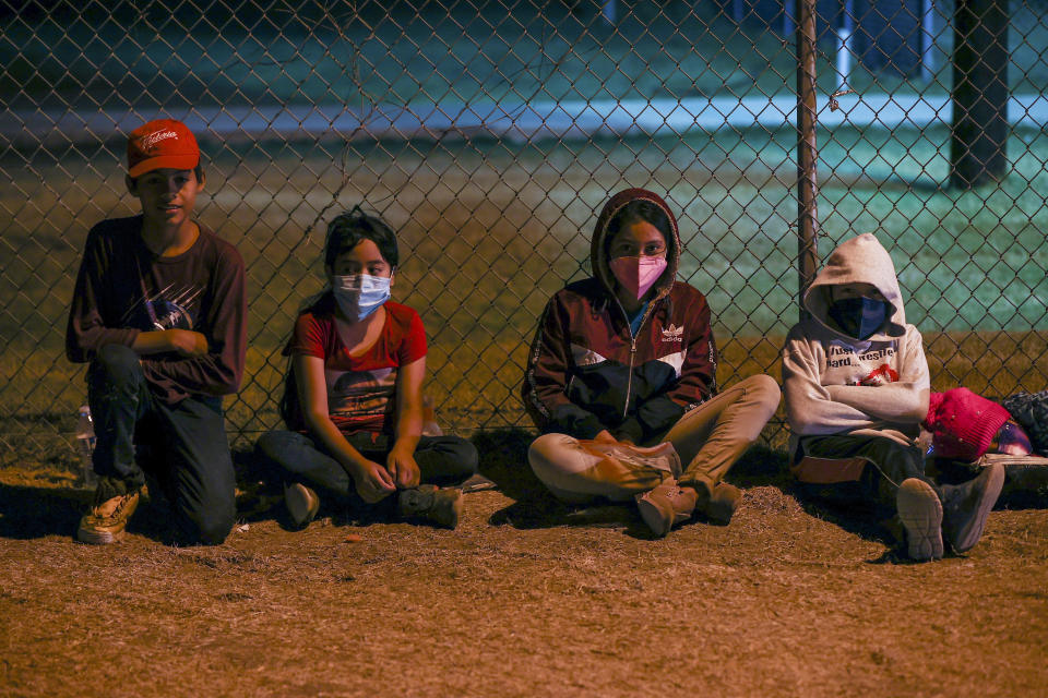 Young migrants from Honduras, Guatemala and El Salvador wait to board the bus after crossing the Rio Grande river from Mexico aboard to US, in La Joya, Texas, United States on April 8, 2021. / Credit: Tayfun Coskun/Anadolu Agency via Getty Images