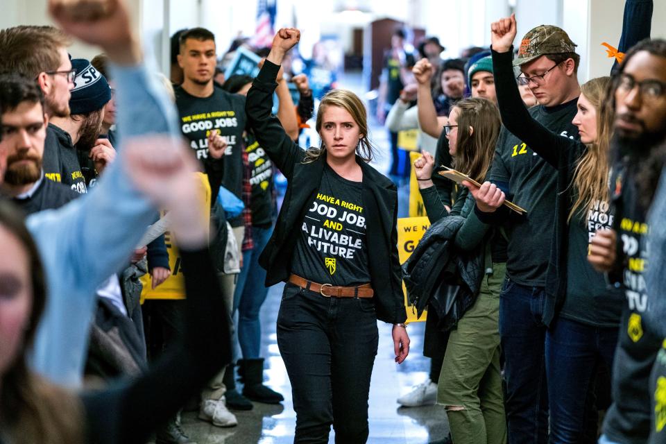 Supporters of the Green New Deal rally outside the office of Democratic Congressman from Maryland and House Minority Whip Steny Hoyer in Washington, DC, December 2018.