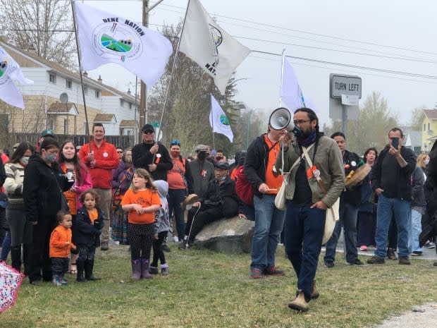 Hundreds of people, many donned in orange clothing, took to the streets of Yellowknife to honour the 215 children whose remains were found at a former residential school in Kamloops, B.C.