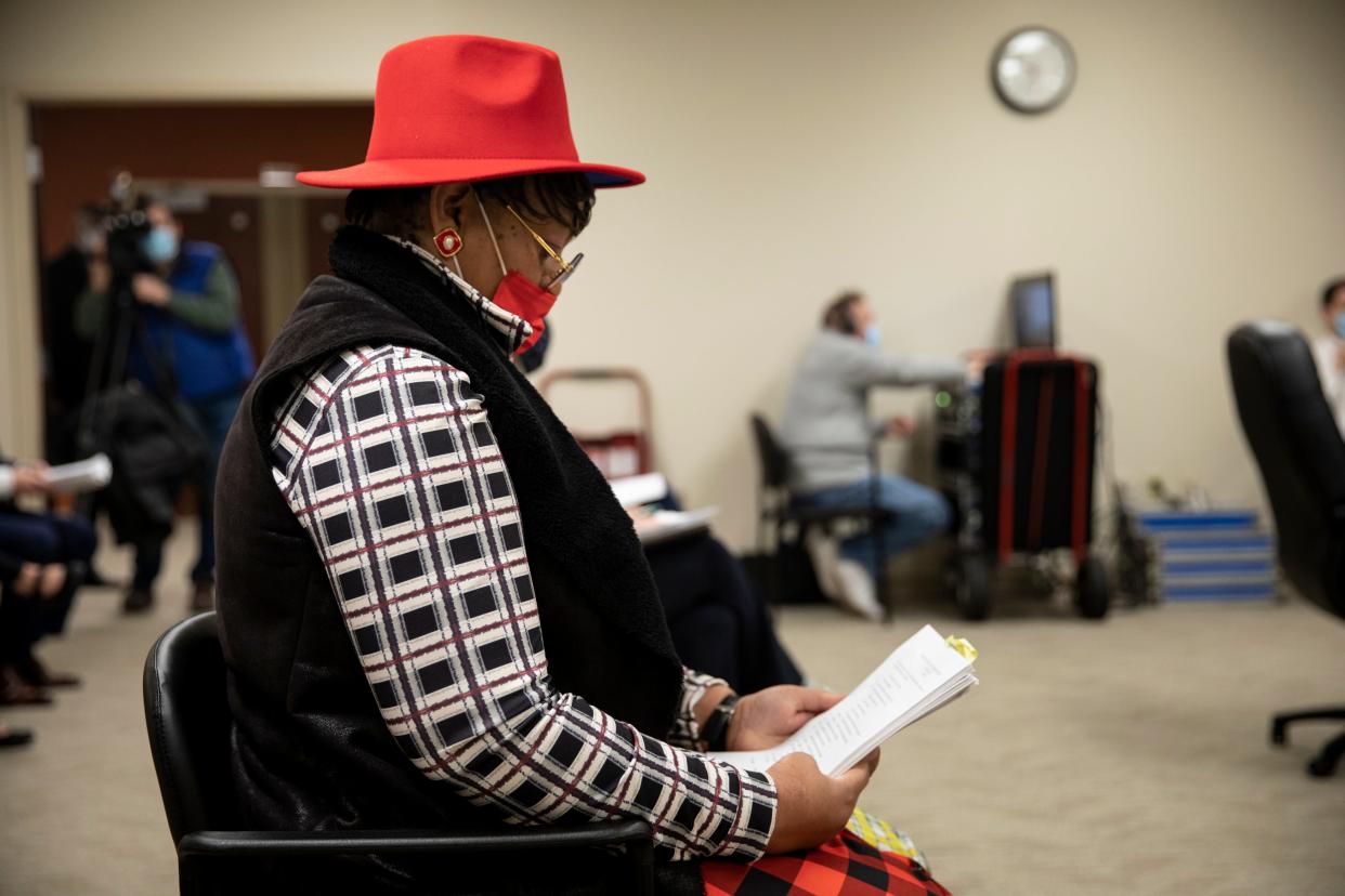 Kelli Prather holds her signed petitions to become a Cincinnati mayoral candidate at the Hamilton County Board of Elections in 2021.