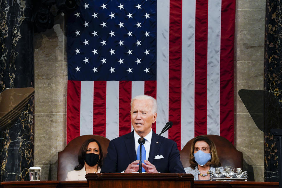 President Joe Biden addresses a joint session of Congress, Wednesday, April 28, 2021, in the House Chamber at the U.S. Capitol in Washington, as Vice President Kamala Harris, left, and House Speaker Nancy Pelosi of Calif., look on. (Melina Mara/The Washington Post via AP, Pool)