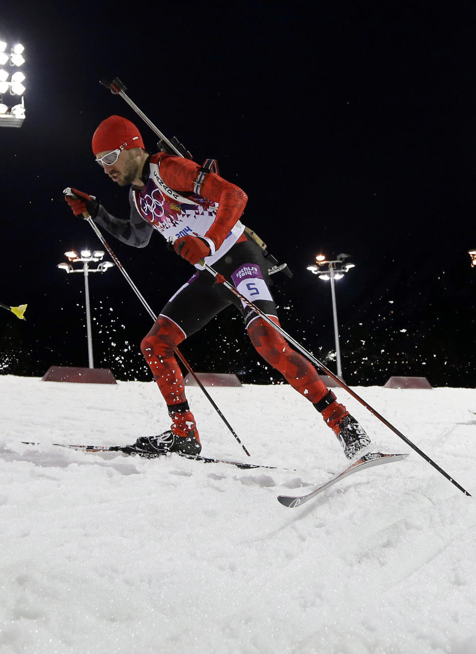 Canada's Jean-Philippe le Guellec competes during the men's biathlon 12.5k pursuit, at the 2014 Winter Olympics, Monday, Feb. 10, 2014, in Krasnaya Polyana, Russia. (AP Photo/Kirsty Wigglesworth)