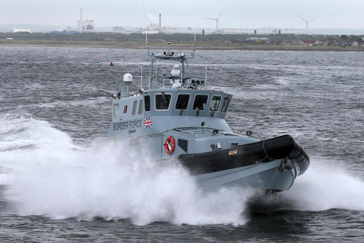 A Border Force boat arrived after 'distressed' asylum seekers were rescued off the Dover coast: PA