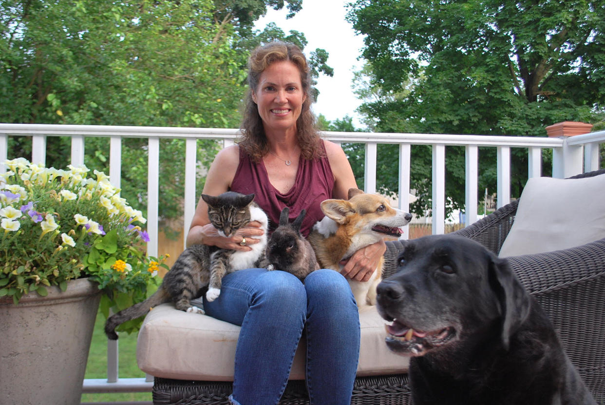 Ashley Collins with her cat, Sugar, her rabbit, Cocoa, and her two dogs, Charlie and Hank. (Photo: Courtesy of Ashley Collins)