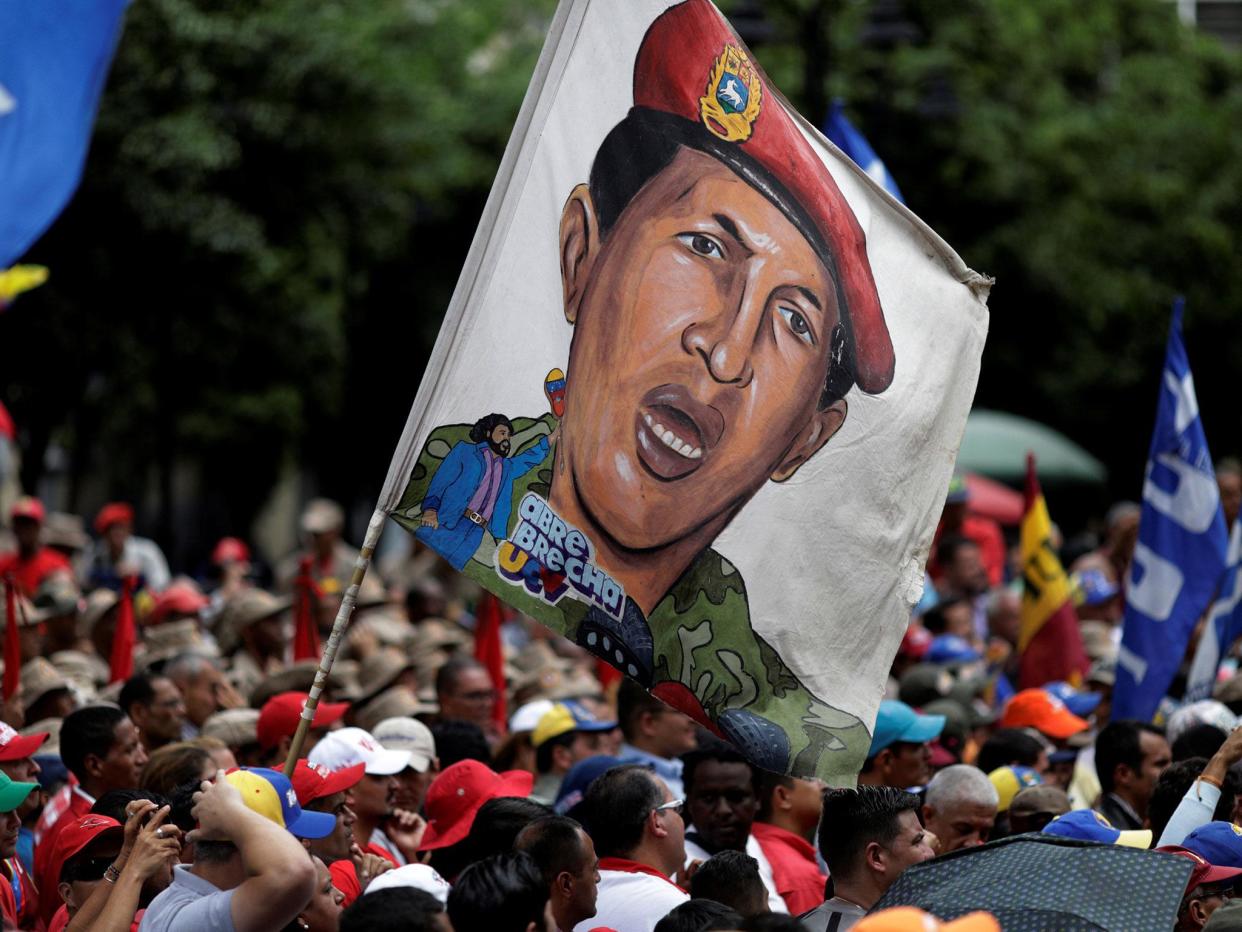 Pro-government supporters with an image of late President Hugo Chavez at a march in Caracas: Reuters