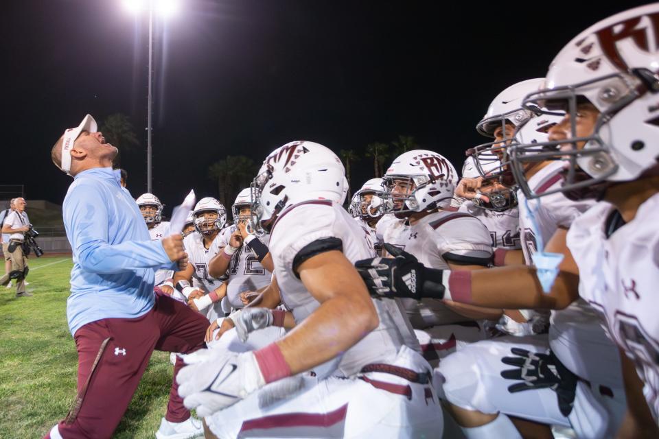 LD Matthews of Rancho Mirage shouts "How bout them Rattlers" to his team after a win over Palm Springs on Sept. 29, 2023.