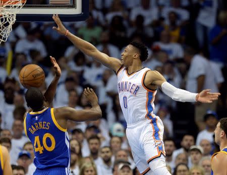 May 22, 2016; Oklahoma City, OK, USA; Golden State Warriors forward Harrison Barnes (40) defends Oklahoma City Thunder guard Russell Westbrook (0) during the third quarter in game three of the Western conference finals of the NBA Playoffs at Chesapeake Energy Arena. Mandatory Credit: Mark D. Smith-USA TODAY Sports