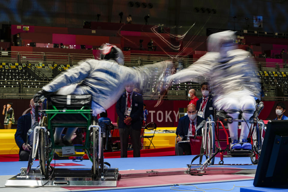 FILE - Brazil's Vanderson Chaves, left, and France's Maxime Valet compete in men's saber individual, category B preliminary wheelchair fencing at the Tokyo 2020 Paralympic Games, in Chiba, Japan, Aug. 25, 2021. Vanderson Chaves has faced many challenges in more than a decade as a Paralympic fencer, but none as fearsome as the massive floods in Brazil’s Rio Grande do Sul state. (AP Photo/Kiichiro Sato, File)
