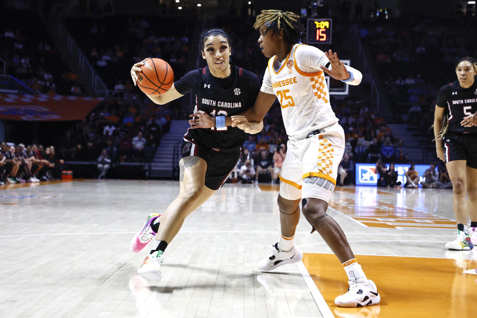 South Carolina guard Brea Beal, left, drives as she is defended by Tennessee guard Jordan Horston (25) during the first half of an NCAA college basketball game, Thursday, Feb. 23, 2023, in Knoxville, Tenn. (AP Photo/Wade Payne)