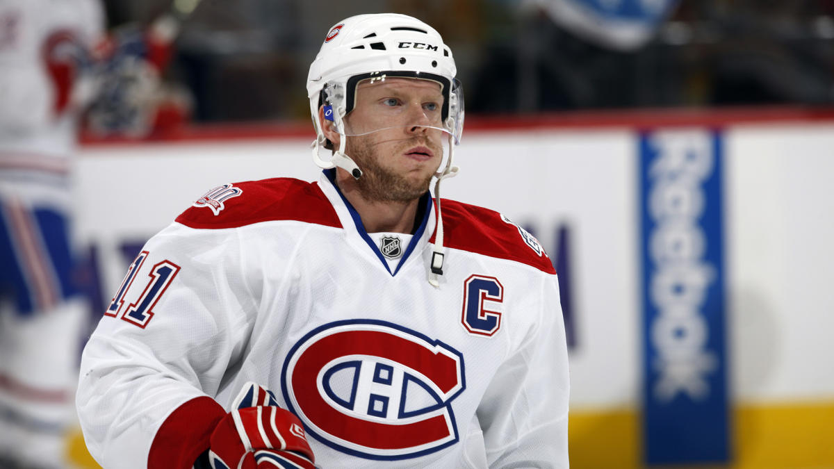 Members of the Montreal Canadiens and the Winnipeg Jets fight in