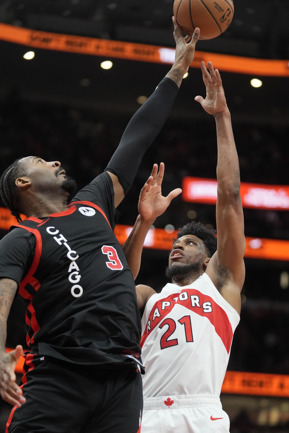 Chicago Bulls center Andre Drummond (3) block a shot from Toronto Raptors forward Thaddeus Young (21) during the second half of an NBA basketball game Tuesday, Jan. 30, 2024, in Chicago. Toronto won 118-107. (AP Photo/Erin Hooley)