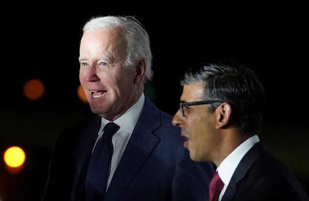 Rishi Sunak greets Joe Biden on his arrival at RAF Aldergrove airbase in County Antrim, Northern Ireland April 11, 2023. REUTERS/Kevin Lamarque