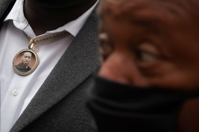 Image of George Floyd hangs from necklace worn by family member during closing arguments in murder trial in Minneapolis