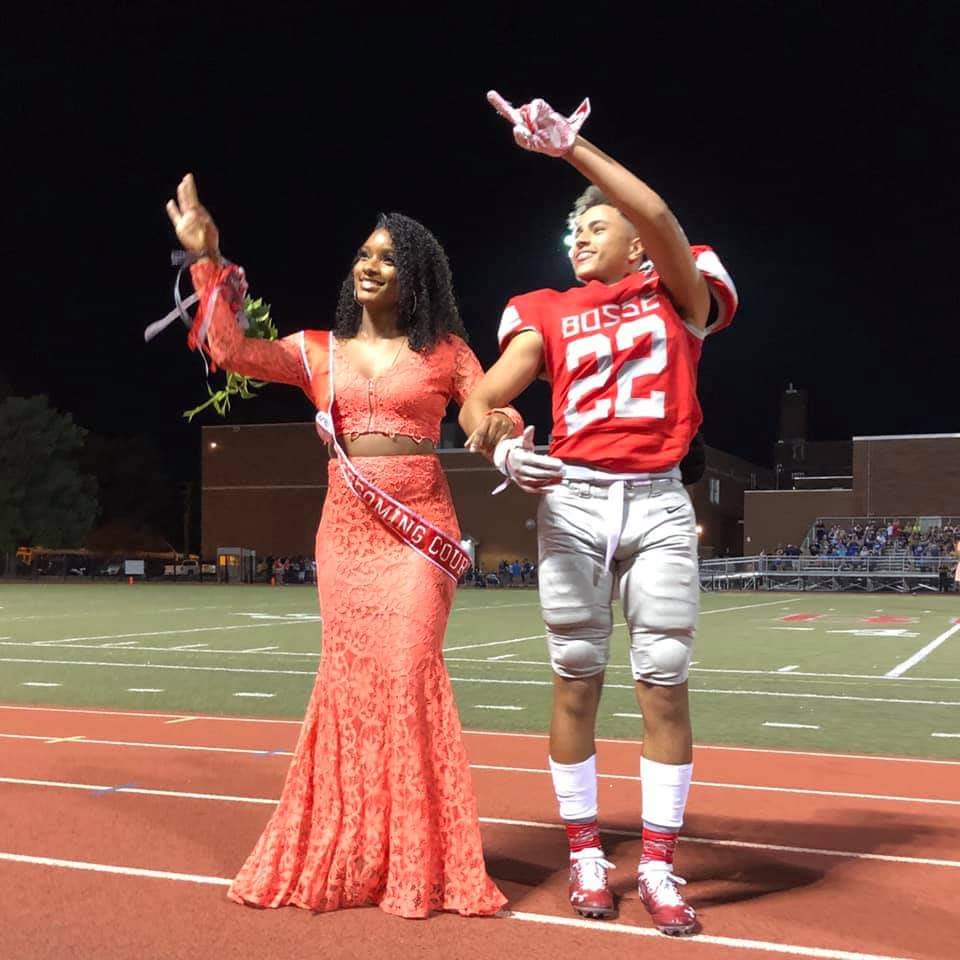 Kielyn Toone points to the crowd during a homecoming football game in 2019 with Nykara Dixon.