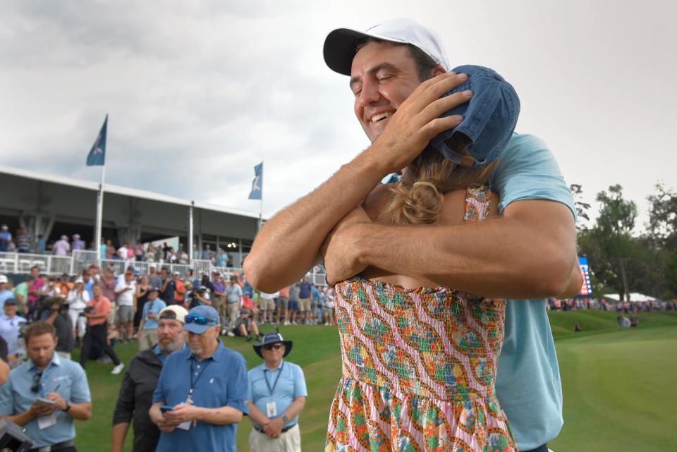 Scottie Scheffler hugs his wife Meredith after winning the 2023 Players Championship at the Players Stadium Course at TPC Sawgrass.