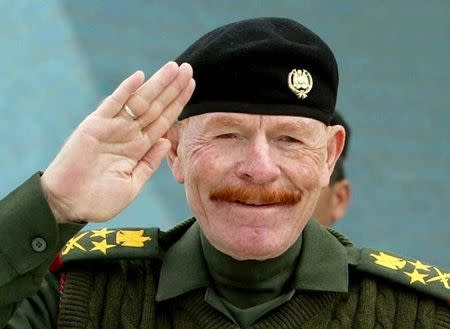 A file photograph shows Ezzat al-Douri, chairman of the ruling Revolutionary Command Council, during a military celebration in Baghdad February 16, 2003.