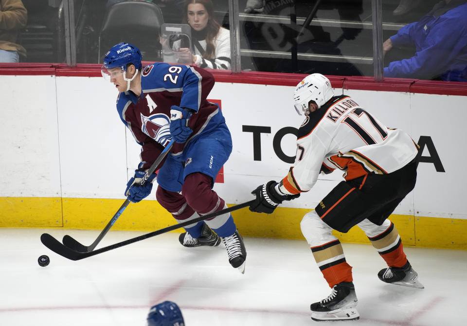 Colorado Avalanche center Nathan MacKinnon, left, drives past Anaheim Ducks left wing Alex Killorn in the first period of an NHL hockey game Wednesday, Nov. 15, 2023, in Denver. (AP Photo/David Zalubowski)