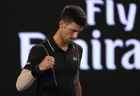 Tennis - Australian Open - Margaret Court Arena, Melbourne, Australia, January 20, 2018. Serbia's Novak Djokovic celebrates winning his match against Spain's Albert Ramos-Vinolas. REUTERS/Issei Kato