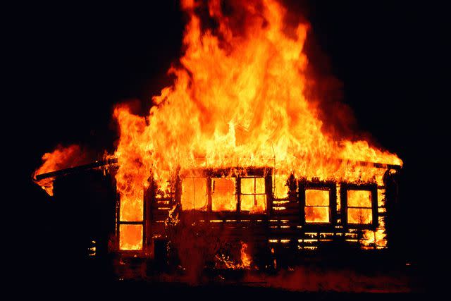 <p>getty</p> Stock image of a house on fire