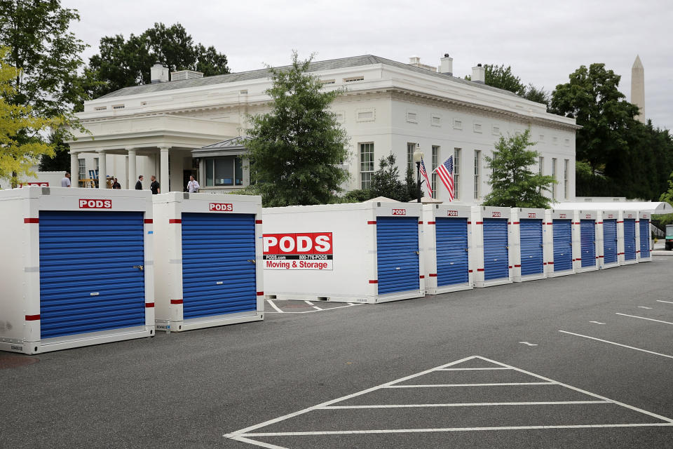 Furniture and materials from the White House are stored in temporary containers outside the West Wing.