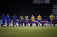 French soccer players warm up during a training session at the Jassim Bin Hamad stadium in Doha, Qatar, Tuesday, Nov. 29, 2022 on the eve of the group D World Cup soccer match between Tunisia and France. (AP Photo/Christophe Ena)