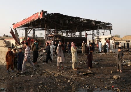 Afghan residents inspect the site of a blast in Kabul