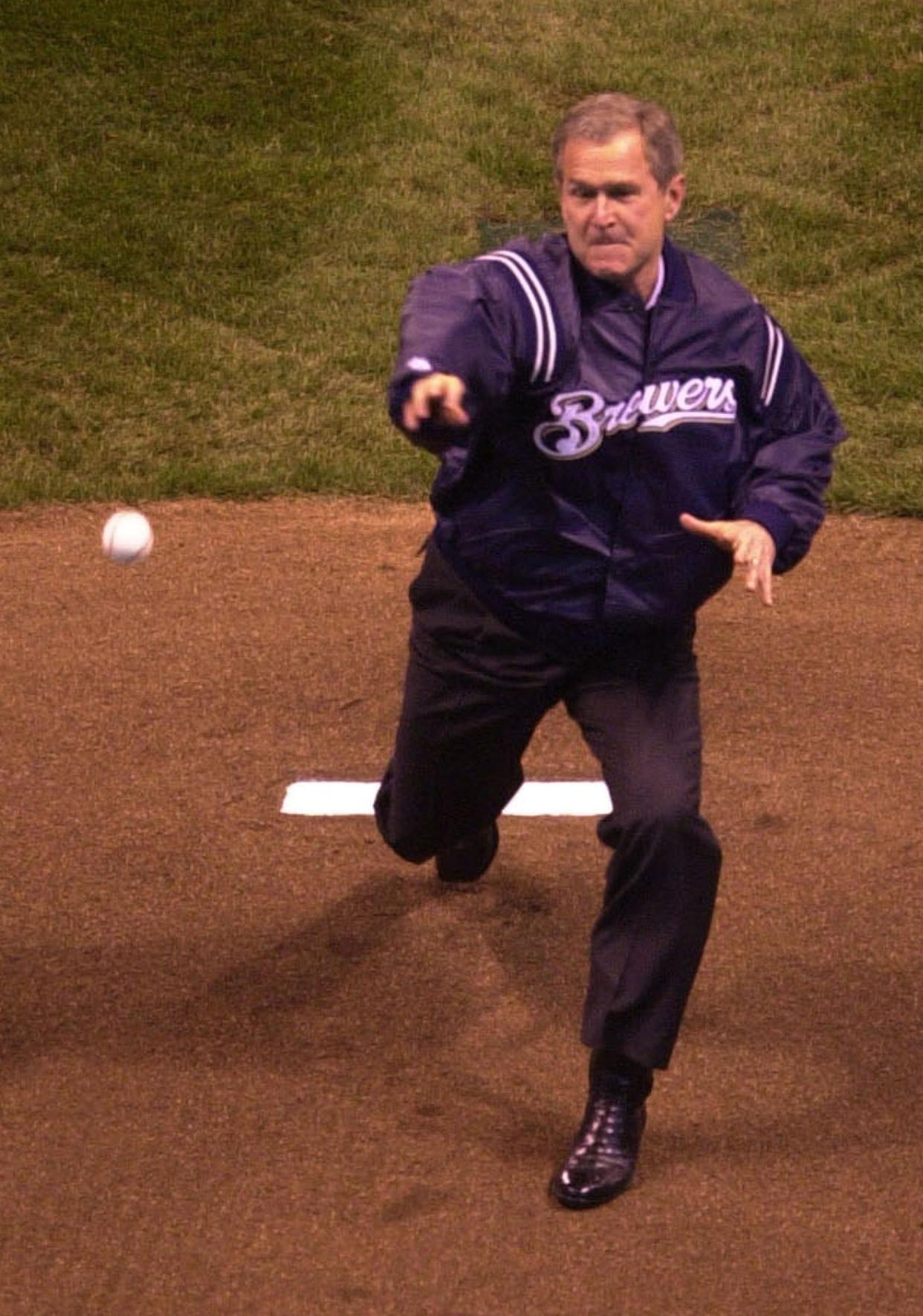 President George W. Bush throws out the first pitch at Miller Park in Milwaukee on April 6, 2001. The pitch fell short of home plate.