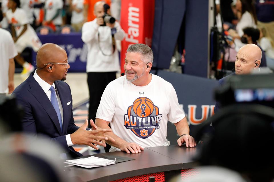 Feb 12, 2022; Auburn, Alabama, USA;  Auburn Tigers head coach Bruce Pearl talks with host LaPhonso Ellis on the set of the ESPN College Gameday broadcast before the game between the Auburn Tigers and the Texas A&M Aggies at Auburn Arena. Mandatory Credit: John Reed-USA TODAY Sports