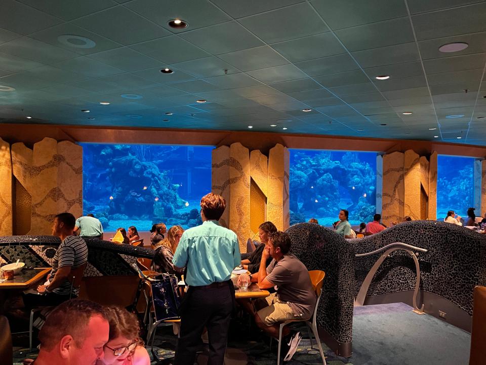 interior shot of the big fish tank at coral reef restaurant in epcot at disney world