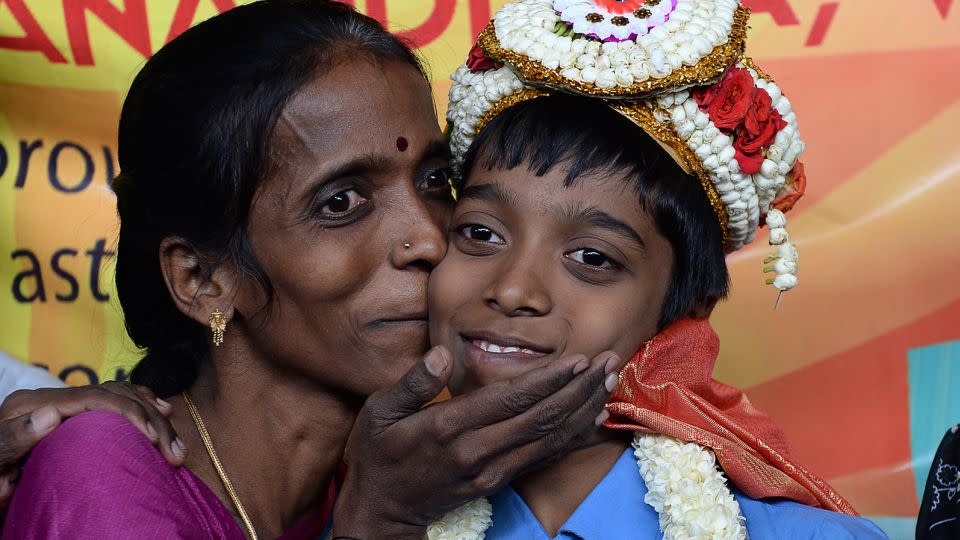 Indian chess prodigy Rameshbabu Praggnanandhaa, then 12, smiles with his mother Nagalakshmi in Chennai on June 26, 2018.  - Arun Sankar/AFP/Getty Images/File