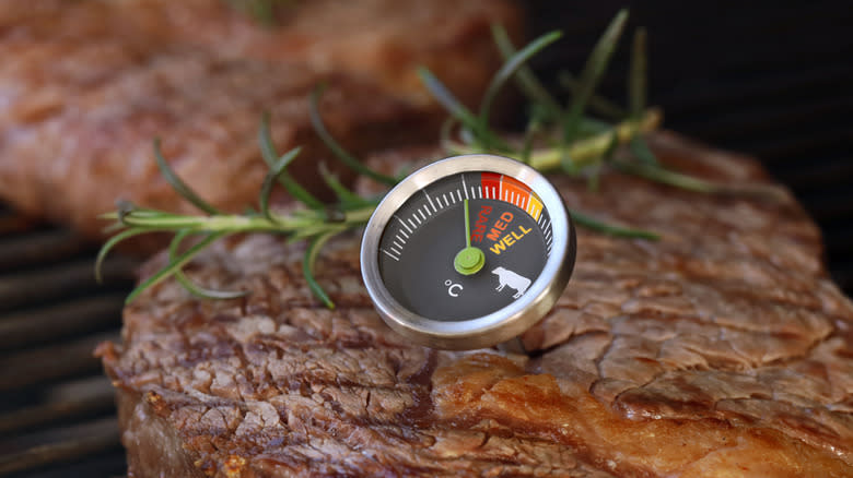testing steak with a meat thermometer