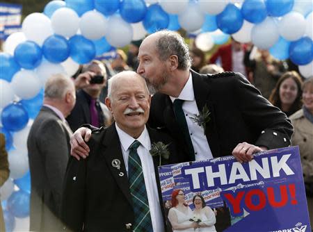 Larry Lamont and Jerry Slater (R) take part in a symbolic same-sex marriage outside the Scottish Parliament in Edinburgh, Scotland February 4, 2014. REUTERS/Russell Cheyne