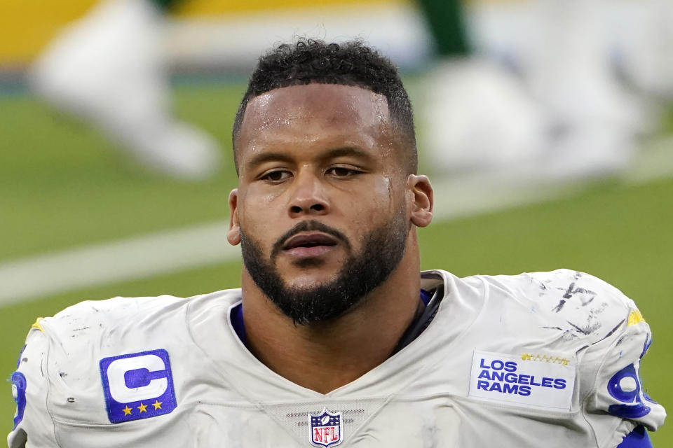 FILE - Los Angeles Rams defensive end Aaron Donald (99) walks off the field after a loss to the New York Jets in an NFL football game in Inglewood, Calif., in this Sunday, Dec. 20, 2020, file photo. A lawyer and his 26-year-old client told Pittsburgh police Wednesday, April 14, 2021, that Los Angeles Rams defensive lineman Aaron Donald and others assaulted the man at a nightclub last weekend, causing multiple injuries. (AP Photo/Jae C. Hong, File)