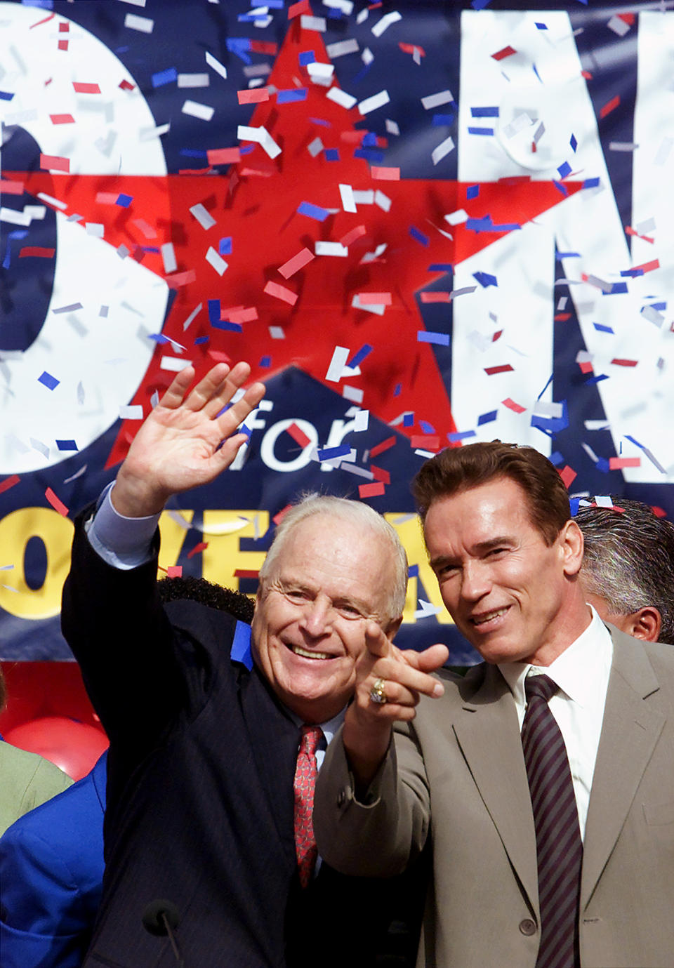 FILE - Former Los Angeles Mayor Richard Riordan, left, is introduced by actor Arnold Schwarzenegger, as they greet supporters Tuesday, Nov. 6, 2001, at a rally as he announces he is joining the field of Republicans seeking the nomination to unseat Democrat Gray Davis for the governor's race. Riordan, the moderate Republican multimillionaire who won two terms as mayor in Democrat-friendly Los Angeles and ran unsuccessfully for governor, died Wednesday, April 19, 2023. He was 92. (AP Photo/Damian Dovarganes, File