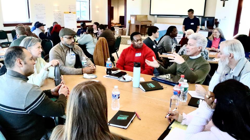 Participants in Urban Rural Action's south-central Pennsylvania program to prevent targeted violence talk in small groups last year in Gettysburg.