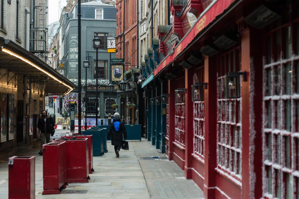 LONDON, UNITED KINGDOM - MARCH 02, 2021: People walk past a closed pub in central London as England remains under third lockdown to reduce the number of Covid-19 infections, on 02 March, 2021 in London, England. Chancellor Rishi Sunak is due to announce his tax and spending plans in 2021 Budget tomorrow with the main focus on measures to support the UK's economic recovery from the slump caused by the coronavirus pandemic including a £5bn scheme for High Street shops and hospitality businesses as well as £408m for museums, theatres and galleries.- PHOTOGRAPH BY Wiktor Szymanowicz / Barcroft Studios / Future Publishing (Photo credit should read Wiktor Szymanowicz/Barcroft Media via Getty Images)