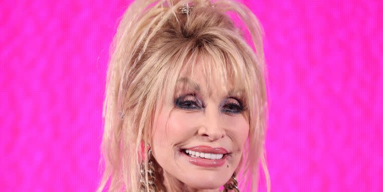 dolly parton wearing pink and smiling at the camera