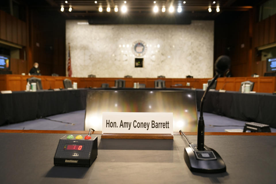 A namecard for Supreme Court nominee Amy Coney Barrett rests on a desk prior to a confirmation hearing before the Senate Judiciary Committee on Capitol Hill in Washington, Monday, Oct. 12, 2020. (AP Photo/Patrick Semansky)