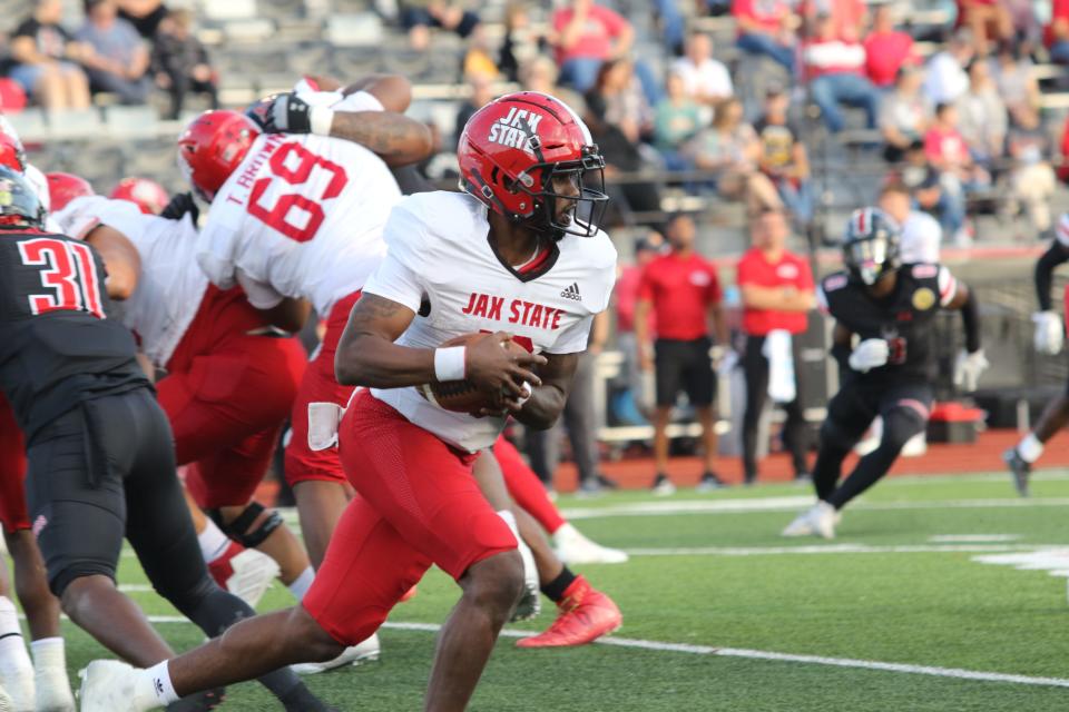 Jacksonville State's Zion Webb takes off with the ball around Austin Peay's defense in the first half during ASUN action Saturday, Oct. 29, 2022 at Fortera Stadium in Clarksville, Tennessee.