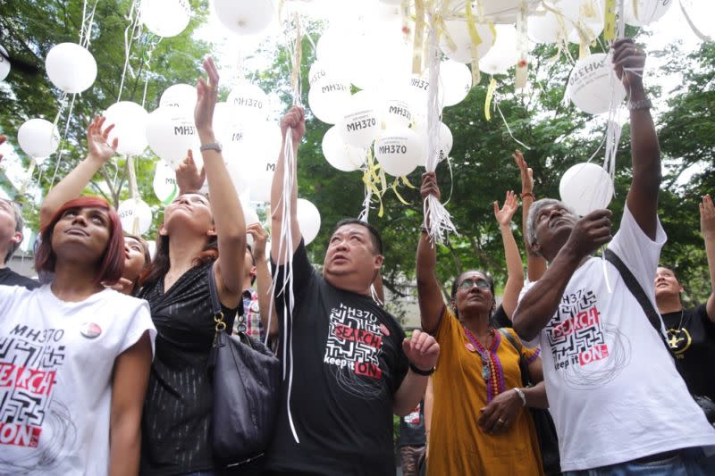 Family members of MH370 victims release 240 balloons printed with the names of their loved ones in Publika, March 6, 2016. — Picture by Choo Choy May