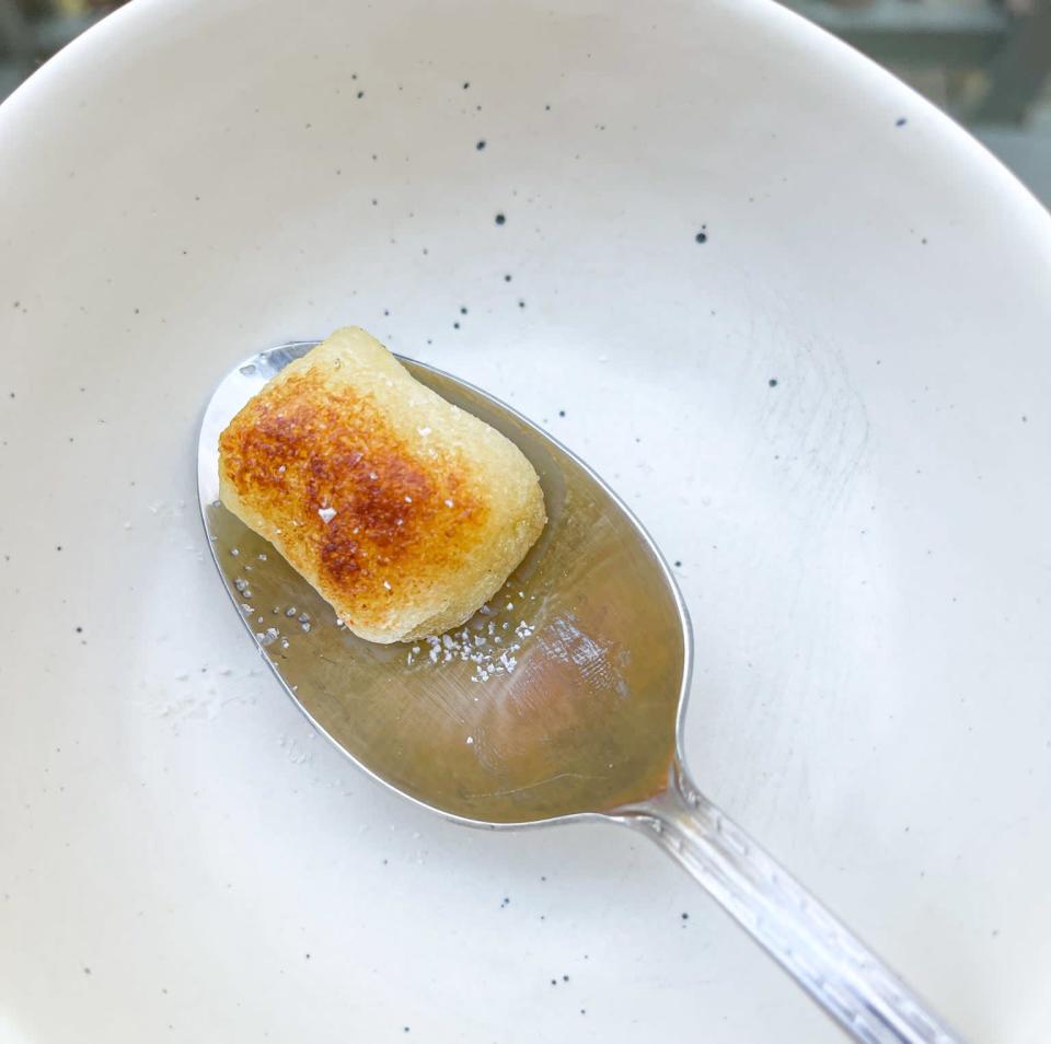 pan-fried gnocchi on a spoon