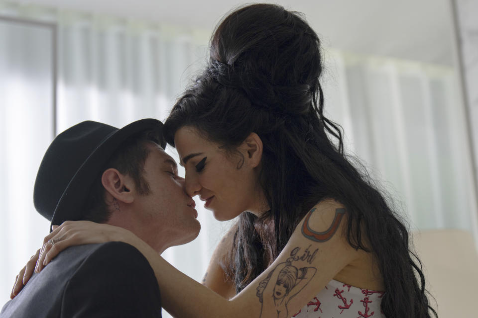 This image released by Focus Features shows Jack O'Connell as Blake Fielder-Civil, left, and Marisa Abela as Amy Winehouse, in a scene from "Back to Black." (Focus Features via AP)