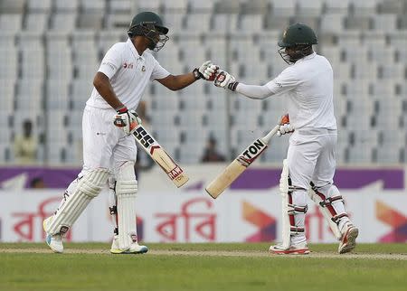 Cricket - Bangladesh v England - Second Test cricket match - Sher-e-Bangla Stadium, Dhaka, Bangladesh - 29/10/16. Bangladesh's Imrul Kayes (R) is congratulated by his teammate Mohammad Mahmudullah after scoring his half century. REUTERS/Mohammad Ponir Hossain