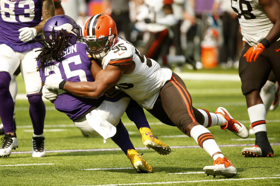 Minnesota Vikings running back Alexander Mattison (25) is tackled by Cleveland Browns defensive end Myles Garrett (95) during the second half of an NFL football game, Sunday, Oct. 3, 2021, in Minneapolis. (AP Photo/Bruce Kluckhohn)