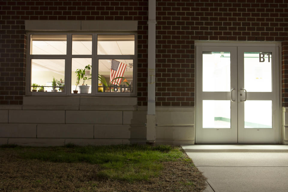 A classroom remains lit up at night at Minnechaug Regional High School.  (Matt Nighswander / NBC News)