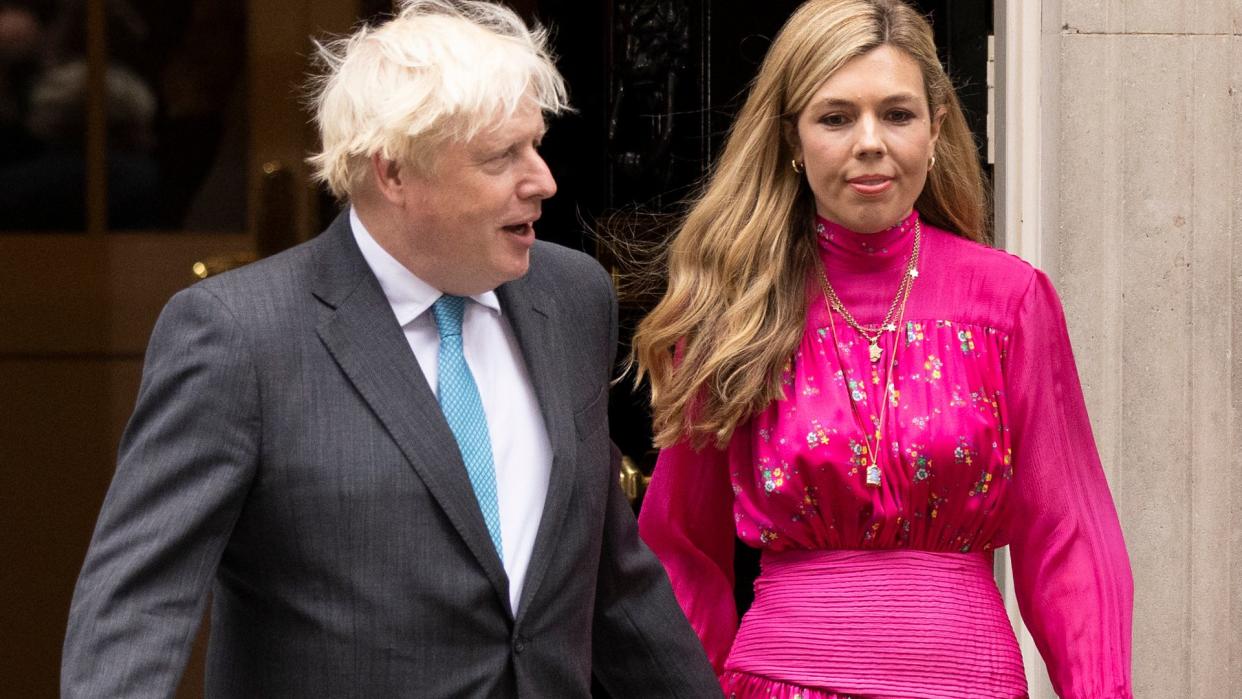 Former Prime Minister Boris Johnson and wife Carrie Johnson at Downing Street.Carrie is wearing a pink dress 