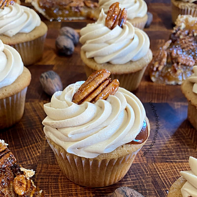 <p>Lady Behind the Curtain</p><p>Pecan pie meets delicate brown sugar cupcakes.</p><p><strong>Get the recipe:</strong> <a href="https://www.ladybehindthecurtain.com/pecan-pie-filled-cupcakes/" rel="nofollow noopener" target="_blank" data-ylk="slk:Pecan Pie Filled Cupcakes;elm:context_link;itc:0;sec:content-canvas" class="link "><strong>Pecan Pie Filled Cupcakes</strong></a></p>