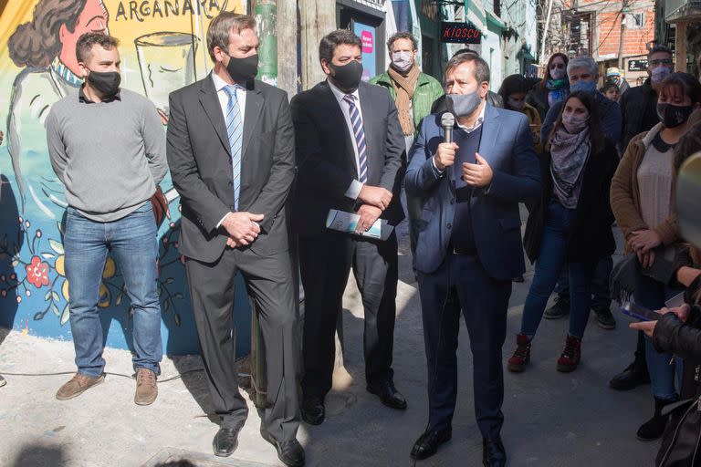 Martín Soria y Juan Mena en un acto con Mariano Recalde