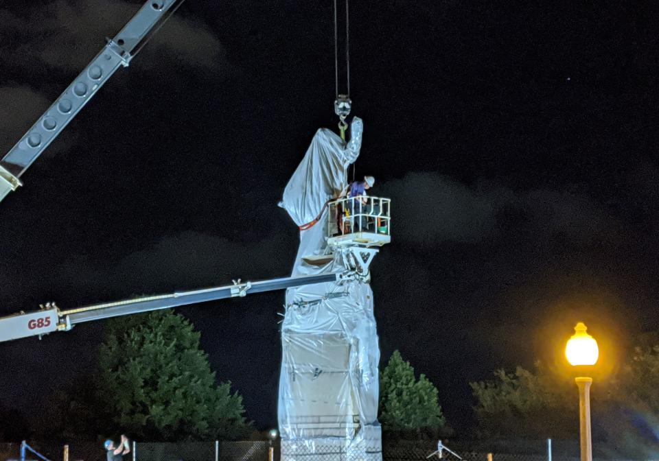 A statue of Christopher Columbus at Grant Park in Chicago is removed early on July 24, 2020. / Credit: DEREK R. HENKLE/AFP/Getty Images